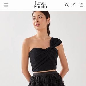 Black crop top. Zipper back. Never worn.